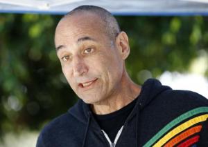 Hollywood mogul and co-creator of The Simpsons, Sam Simon, talks while visiting a chinchilla farm after he financed the purchase of the facility by PETA in Vista